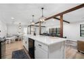 Open concept kitchen with large island and exposed beams at 570 N Burnt Hickory Rd, Douglasville, GA 30134