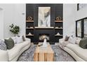 Open living room showcasing a modern fireplace, built-in shelves, and plush seating at 904 Kings Cct Ne Ne, Atlanta, GA 30306