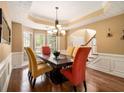 Bright dining room with hardwood floors and a chandelier at 725 Martin Field Se Dr, Lawrenceville, GA 30045