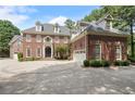 Impressive two-story home with circular driveway at 1446 W Wesley Nw Rd, Atlanta, GA 30327