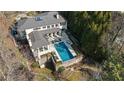 Aerial view showcasing home's expansive backyard and pool at 1500 W Wesley Nw Rd, Atlanta, GA 30327