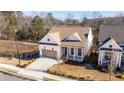Aerial view of a charming craftsman style home with a tan roof at 210 Idylwilde Way, Canton, GA 30115