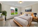 Cozy bedroom showcasing natural light from the window, complemented by warm, neutral tones at 3714 Thunder Ne Way, Marietta, GA 30066