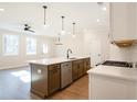 Modern kitchen with island, stainless steel appliances, and white cabinets at 147 Bluffington Way, Marietta, GA 30066