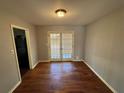 Bright dining room featuring hardwood floors and French doors leading to the outside at 2534 Sharpsburg Ct, Decatur, GA 30034