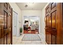 Spacious entryway with hardwood floors and view into the living room at 2865 Lenox Ne Rd # 208, Atlanta, GA 30324