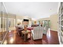 Open living area with hardwood floors, fireplace, built-in shelving, and ample natural light at 2865 Lenox Ne Rd # 208, Atlanta, GA 30324
