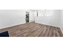 Open dining room with wood-look floors and kitchen access at 2290 Wilkins Cv, Decatur, GA 30035
