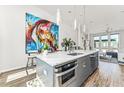 Modern kitchen with island, stainless steel appliances, and white cabinetry at 462 Latta Ne St, Atlanta, GA 30308