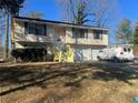 Front view of a two-story house with a yard at 5331 Woodbin Dr, Norcross, GA 30093