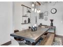 Bright dining room showcases modern lighting, white brick accent wall, and a spacious dining table at 878 Peachtree Ne St # 535, Atlanta, GA 30309