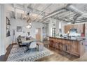 Open concept design with kitchen and dining room featuring industrial ceilings at 878 Peachtree Ne St # 535, Atlanta, GA 30309