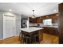 Kitchen featuring a center island, stainless steel appliances, and hardwood floors at 4286 Pool Rd, Winston, GA 30187