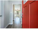 Bright entryway with red front door and view into the living area at 4509 Central Dr, Stone Mountain, GA 30083