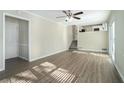 Spacious living room featuring hardwood floors and a ceiling fan at 4509 Central Dr, Stone Mountain, GA 30083