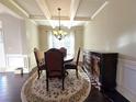 Bright dining room with hardwood floors and large windows at 965 Mulberry Bay Dr, Dacula, GA 30019