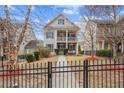 Two-story house with gray siding, landscaped yard, and fence at 1968 Perry Nw Blvd, Atlanta, GA 30318