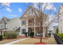 Two-story house with gray siding, front yard, and walkway at 1968 Perry Nw Blvd, Atlanta, GA 30318