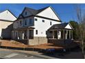 Two-story home with gray roof, white siding, and a covered porch at 3065 Barnes Mill Ct, Roswell, GA 30075