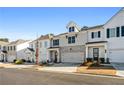 Row of townhouses featuring white and gray exteriors and attached garages at 1706 Pardee Dr, Kennesaw, GA 30152