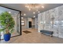 Modern lobby area with sleek tile flooring, marble accent wall, and comfortable seating at 6890 Peachtree Dunwoody Rd # 303, Atlanta, GA 30328
