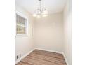 Small dining area with chandelier and hardwood floors at 1512 Pine Glen Cir, Decatur, GA 30035