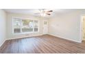 Bright living room with wood-look floors and large window at 1512 Pine Glen Cir, Decatur, GA 30035