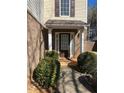 Inviting front entrance with brick facade, landscaping, and a charming walkway at 3954 Riverside Pkwy, Decatur, GA 30034