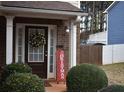 Inviting front porch with brick facade and festive decor at 3954 Riverside Pkwy, Decatur, GA 30034