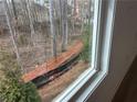 A serene view of the wooded area outside the window at 401 Carrera Ln, Acworth, GA 30102