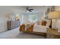 Bright bedroom featuring a king-size bed and calming decor at 417 Carrera Ln, Acworth, GA 30102