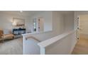 Upstairs hallway with light wood floors and access to bedrooms and bath at 417 Carrera Ln, Acworth, GA 30102