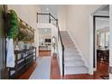 Two-story foyer with hardwood floors, a staircase, and decorative console table at 437 Cherry Tree Ln, Marietta, GA 30066