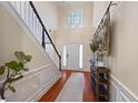 Two-story foyer with hardwood floors, a staircase, and decorative console table at 437 Cherry Tree Ln, Marietta, GA 30066