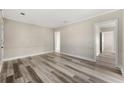 Open living room with wood-look floors and access to other rooms at 540 Hamilton E Holmes Nw Dr, Atlanta, GA 30318