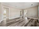 Bright living room featuring gray wood-look flooring at 540 Hamilton E Holmes Nw Dr, Atlanta, GA 30318