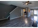 Comfortable living room showcasing wood floors, staircase, and a view of the kitchen at 2566 Walden Lake Dr, Decatur, GA 30035