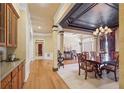 Elegant dining room featuring a chandelier and hardwood floors at 630 Birnamwood Dr, Suwanee, GA 30024