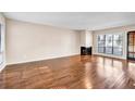 Spacious living room featuring hardwood floors and fireplace at 5019 S Ellipse Dr, Marietta, GA 30068