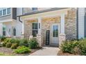 Inviting front entry with brick facade, porch, and welcome sign at 110 Cobalt Dr, Fayetteville, GA 30214