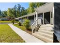 Front entry with steps, walkway, and landscaping at 558 Plainville Dr, Atlanta, GA 30331