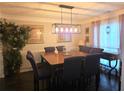 Spacious dining room with seating for six and stylish lighting, perfect for Gathering gatherings at 4908 Topsfield Ln, Lithonia, GA 30038