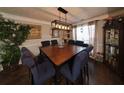 Bright dining room with a large table and hardwood floors at 4908 Topsfield Ln, Lithonia, GA 30038