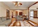 Spacious living room with two sofas, coffee table, and built in shelves at 5762 Lilburn Stone Mountain Rd, Stone Mountain, GA 30087