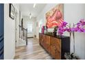 Bright entryway with hardwood floors, staircase, and decorative console table at 3948 Lake Manor Way, Atlanta, GA 30349