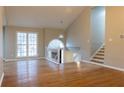 Spacious living room with hardwood floors and high ceilings at 8255 Stonebrook Dr, Cumming, GA 30040