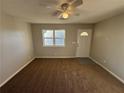 Spacious living room with neutral walls and brown carpet at 1851 Irwin Bridge Nw Rd, Conyers, GA 30012