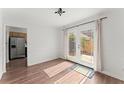 Dining area with hardwood floors and French doors leading to the backyard at 6520 Roswell Rd # 106, Atlanta, GA 30328