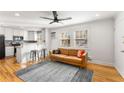 Bright living room with hardwood floors and a modern sofa at 1042 Saint Charles Ne Ave # 1042-7, Atlanta, GA 30306
