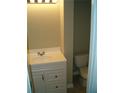 Small bathroom with white vanity and toilet at 295 Flagstone Way # 295, Austell, GA 30168